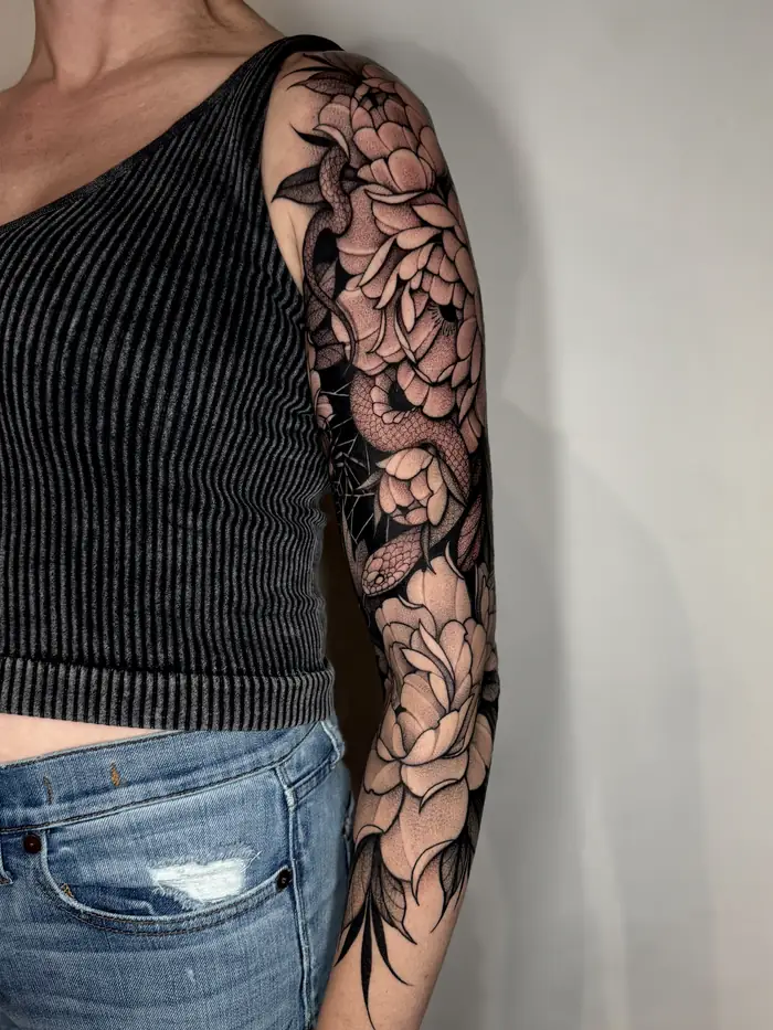 Full sleeve of black and grey peonies