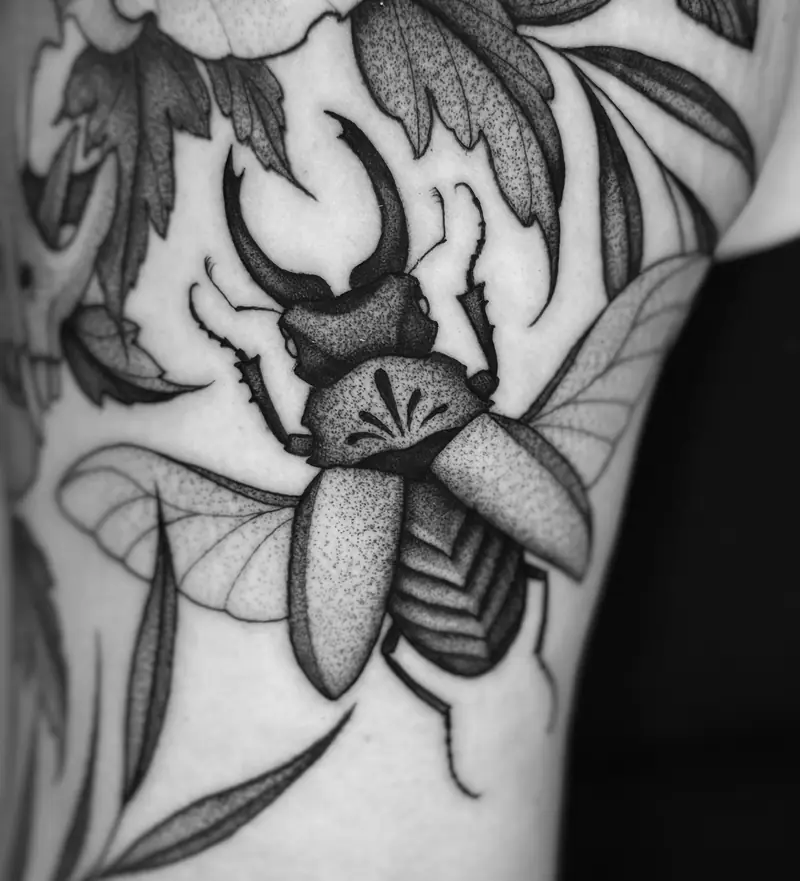 Stag beetle with flowers on the upper arm